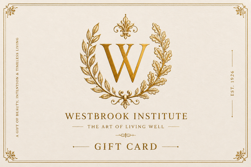 A luxury gift card featuring a gold monogram 'W' inside an ornate laurel wreath, with the text 'WESTROOK INSTITUTE', 'THE ART OF LIVING WELL', and 'GIFT CARD' on a warm cream background.